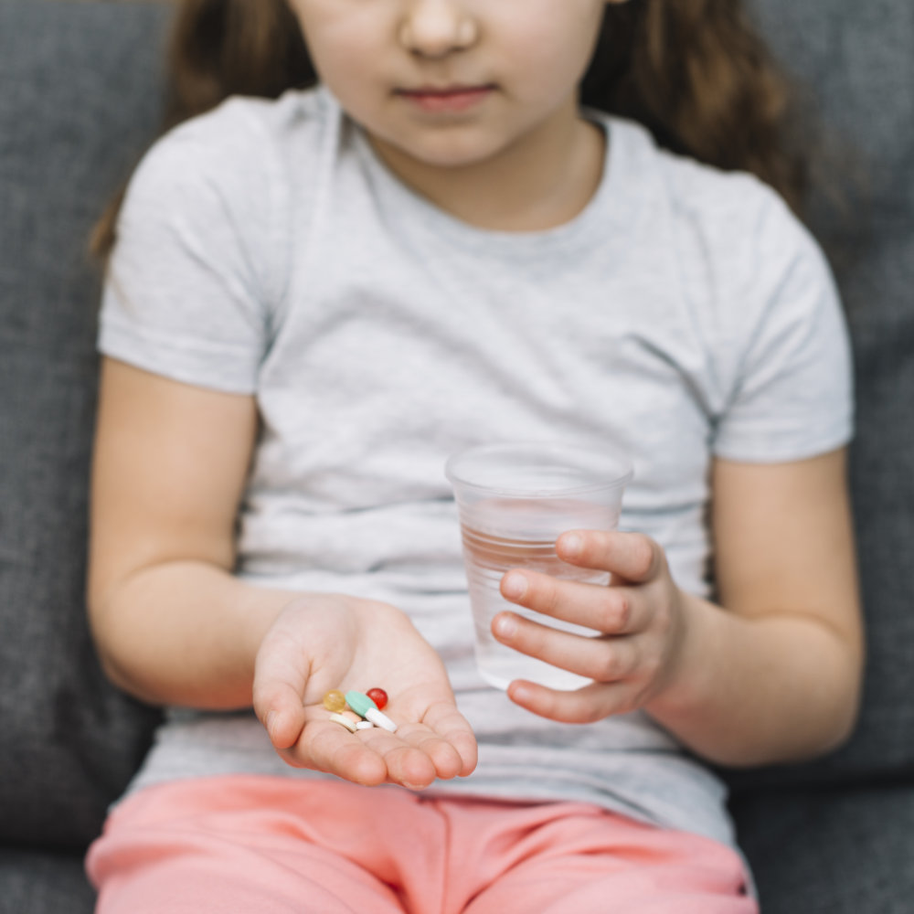 A person using an asthma inhaler