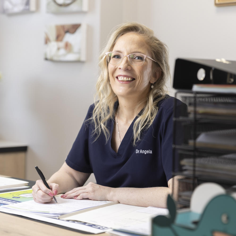 Portrait of a paediatrician in a white coat